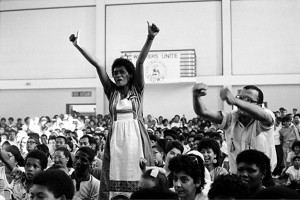 Activist June Esau in a celebrative mood at a mass meeting in Bonteheuwel Civic Centre in Cape Town